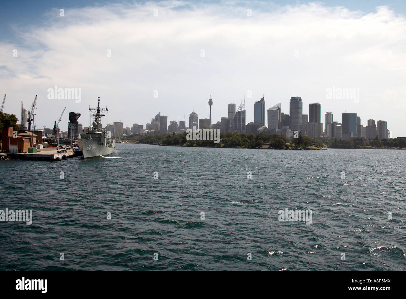 Garden Island RAN Naval base with warship and City Centre skyline buildings in Sydney New South Wales NSW Australia Stock Photo
