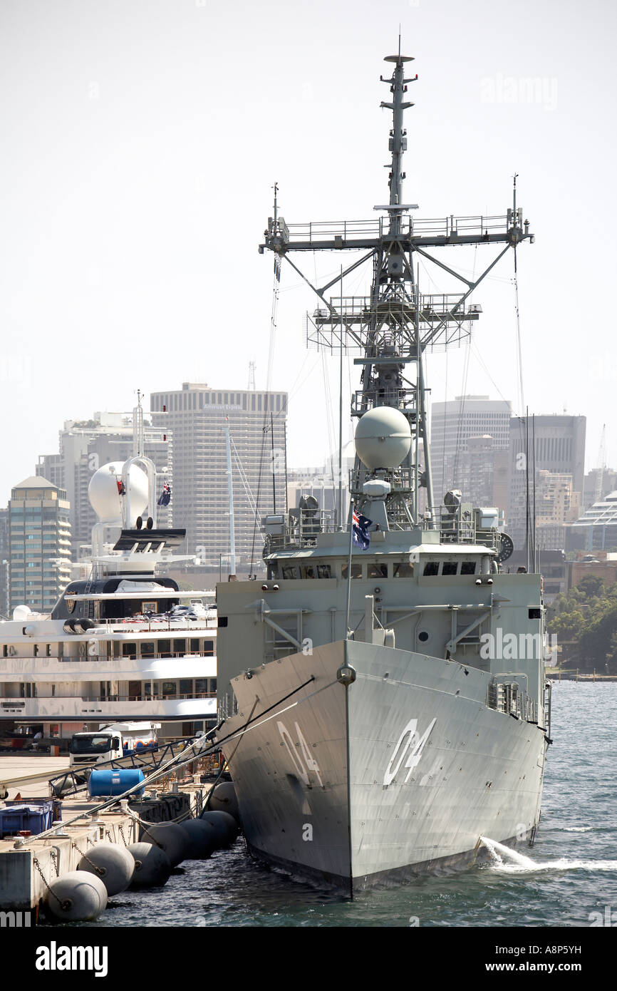 Garden Island RAN Naval base with warship cruiser yacht and City Centre buildings in Sydney New South Wales NSW Australia Stock Photo