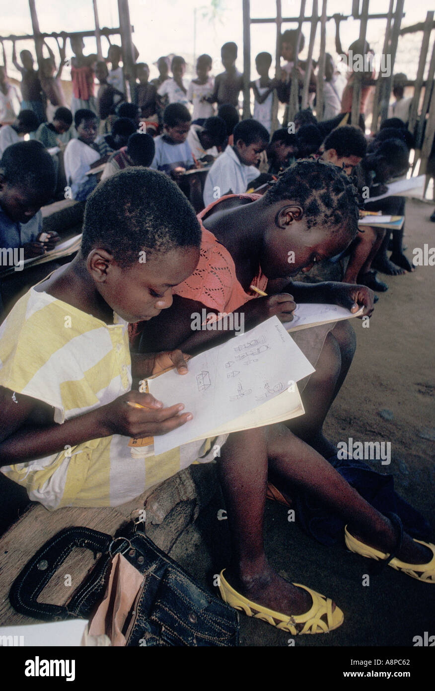 Mozambique war therapy for school kids at Quelimane drawing sketching and reliving their horrific war experience on paper Stock Photo
