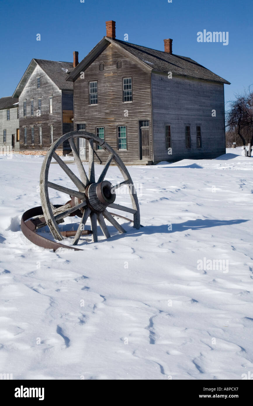 Wagon wheel in winter at the mining ghost town at Fayette Michigan State Park Stock Photo