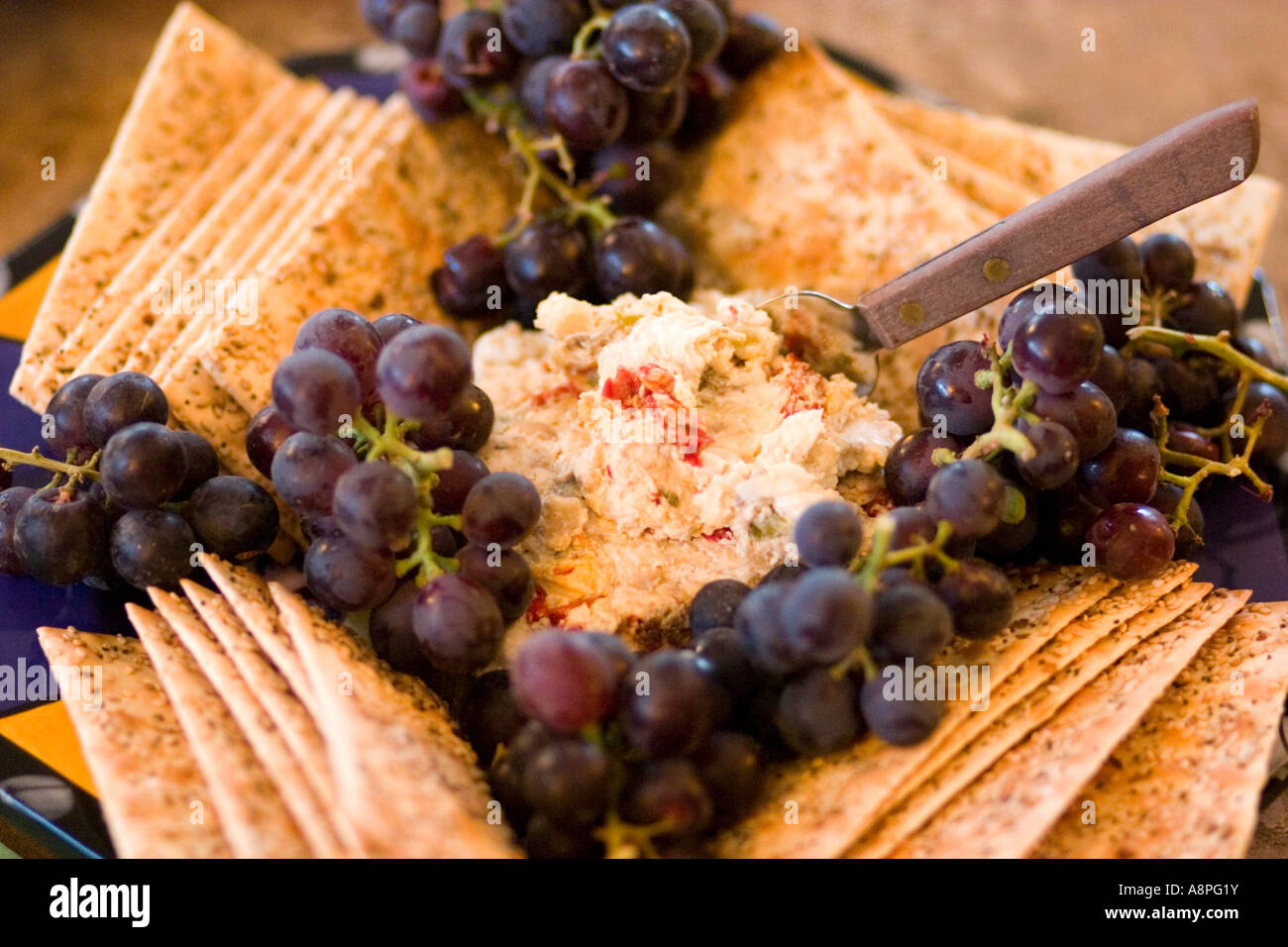 Hors d'oeuvres of crackers grapes and cheese spread. St Paul Minnesota