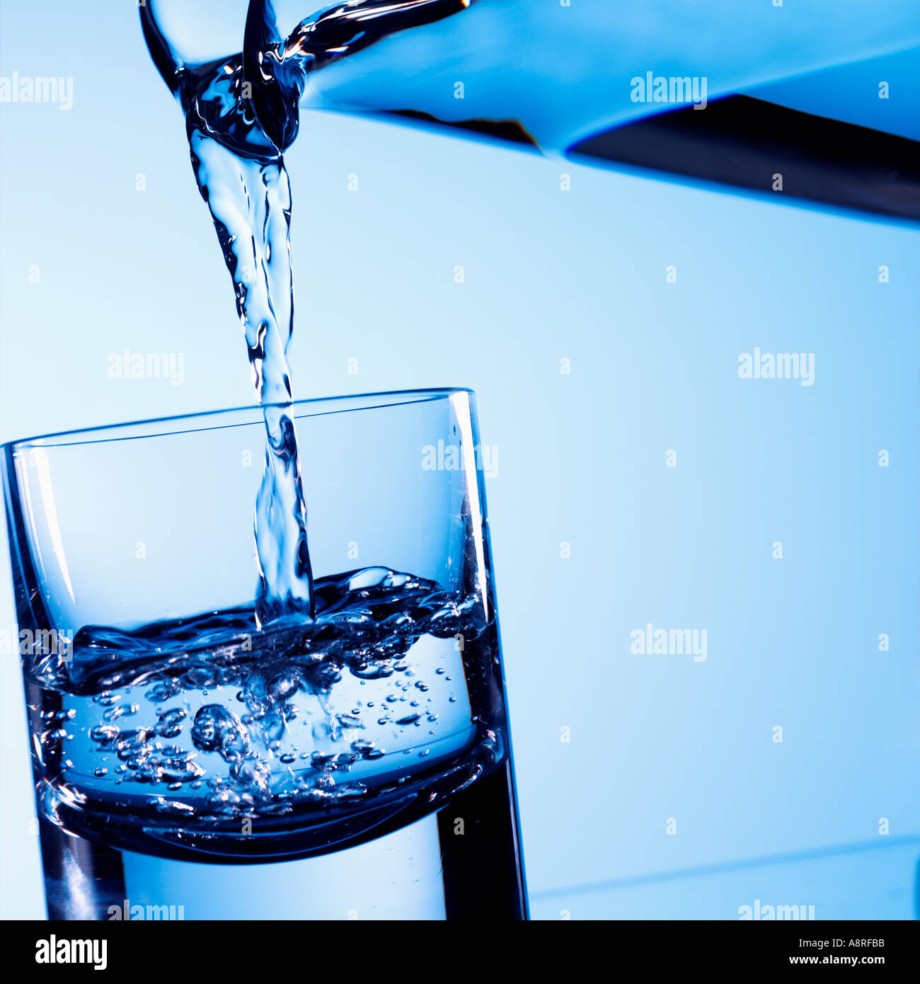 Water pouring into glass Stock Photo Alamy