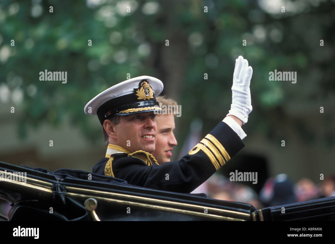 Prince Andrew waving at the crowd during the trooping of the colour with Prince William Stock Photo