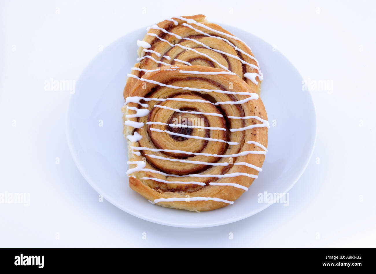 Cinnamon twirl pastries shot in the studio on a white background Stock Photo
