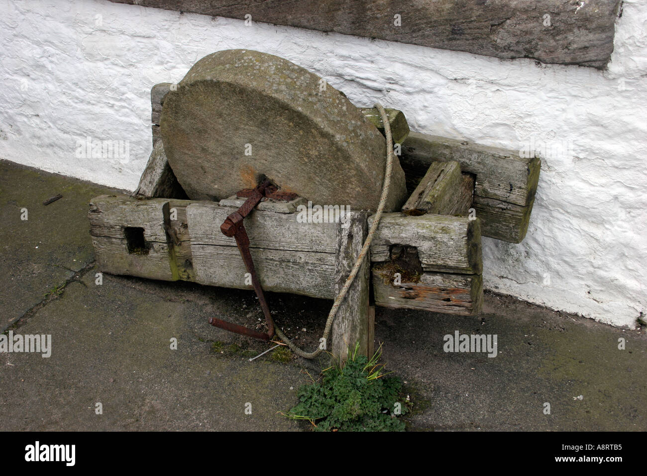 Traditional old stone sharping wheel Stock Photo - Alamy