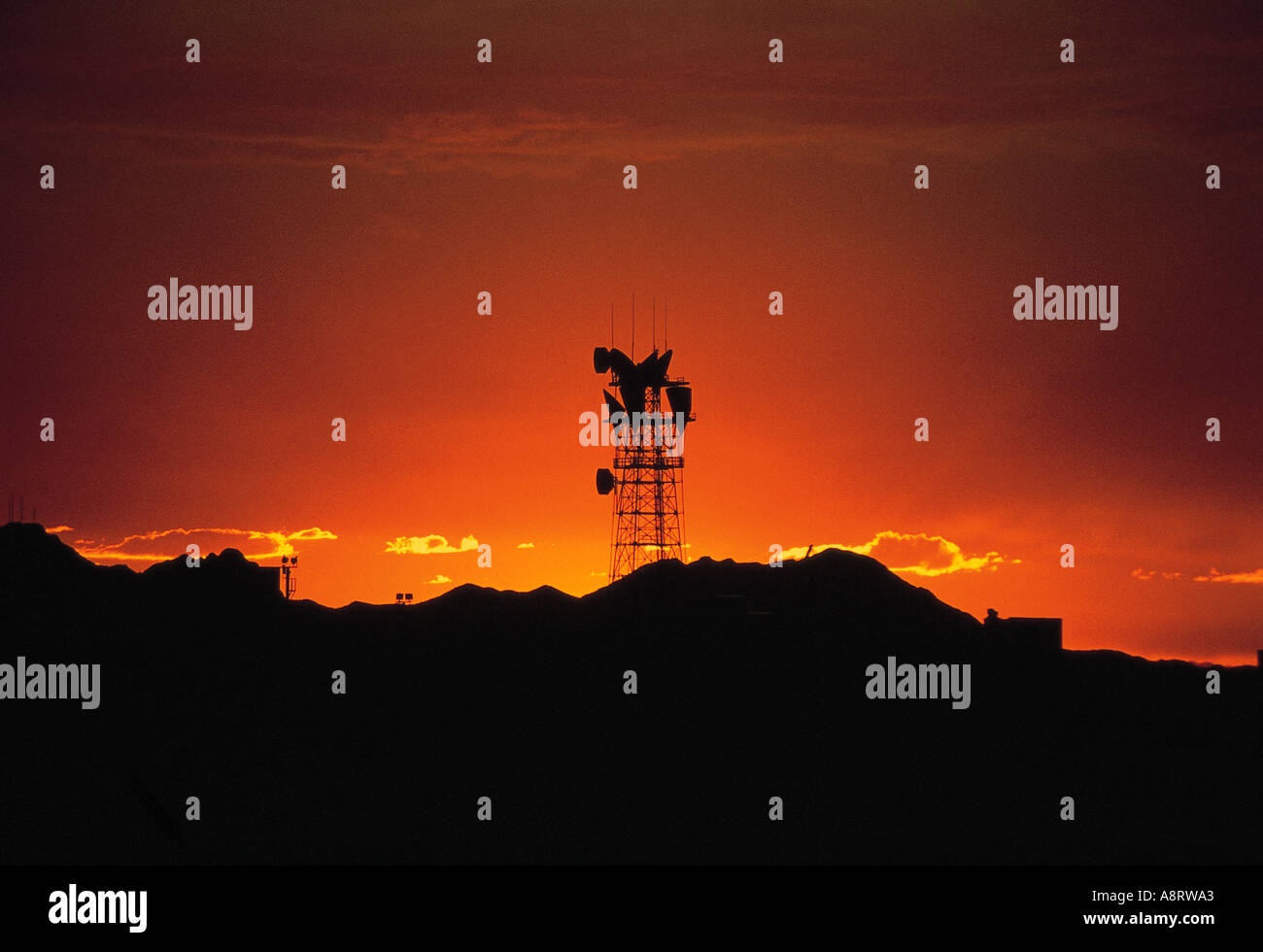 Silhouette of a transmission tower at sunset Stock Photo - Alamy