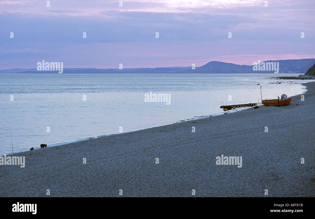 Branscombe pebble beach devon fishing boat Stock Photo - Alamy