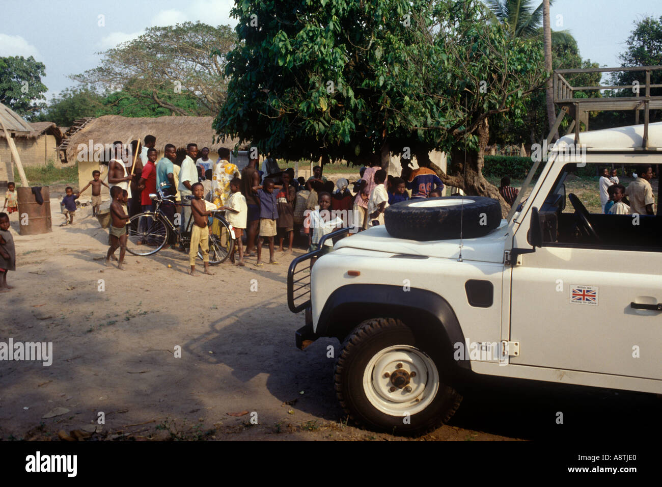 A British Council Land Rover which has brought British agricultural  advisors to a village meeting in Ghana Stock Photo - Alamy