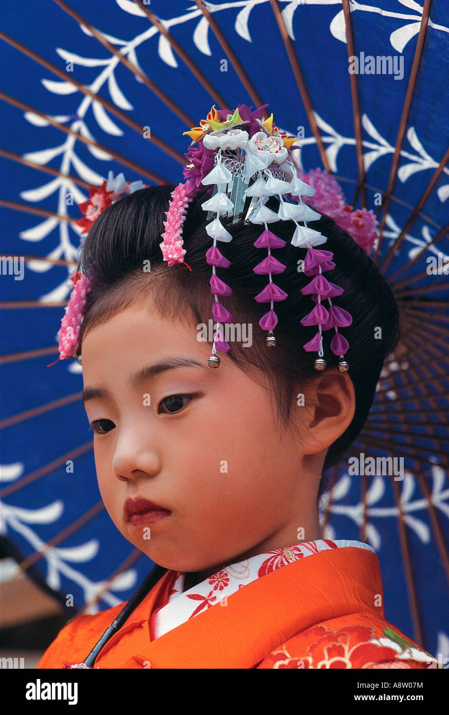 Japan. Tokyo. Outdoor portrait of child girl wearing festival headdress. Stock Photo