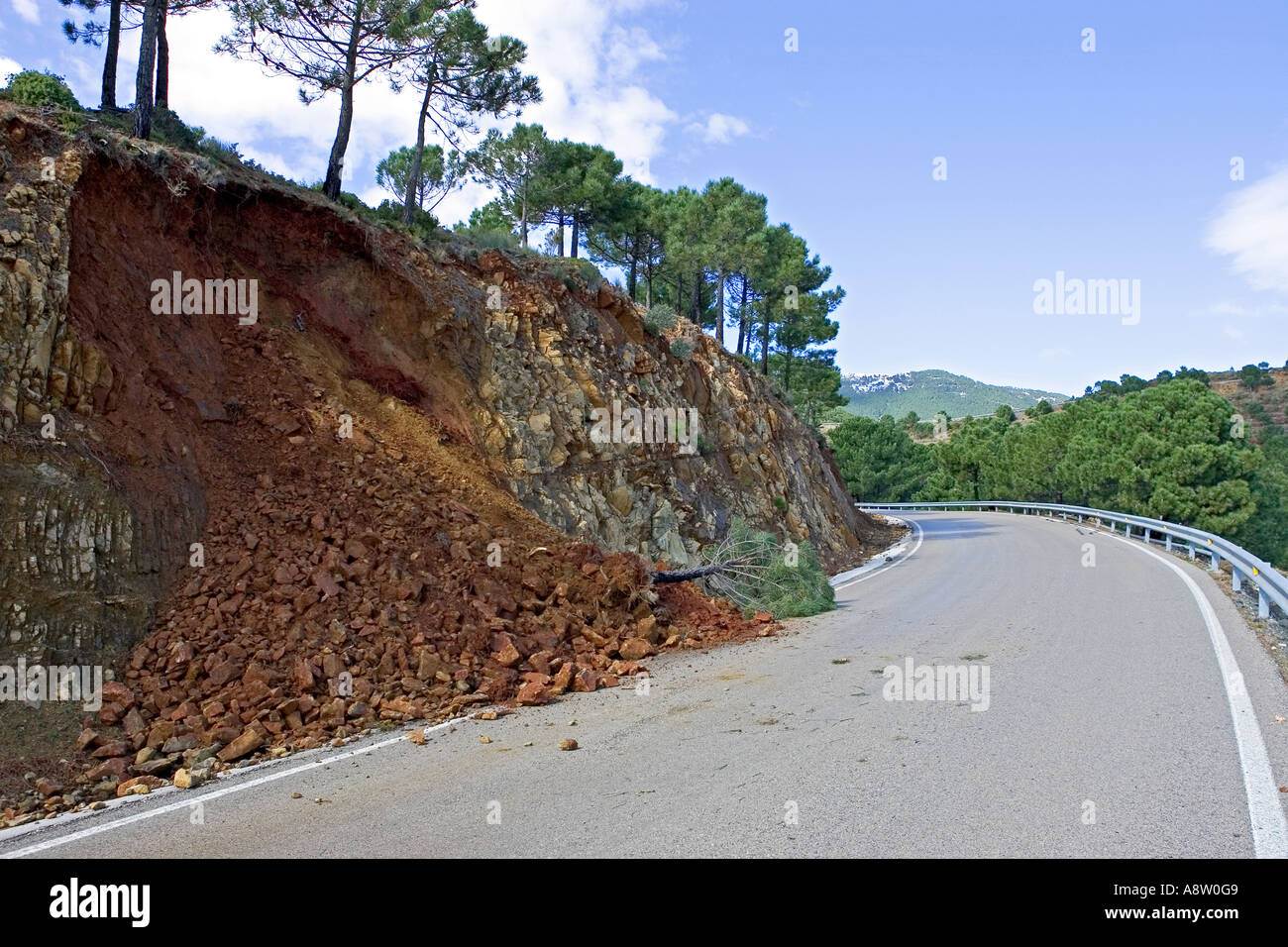 Land or mudslide on mountain road after heavy storm in Spain Stock Photo