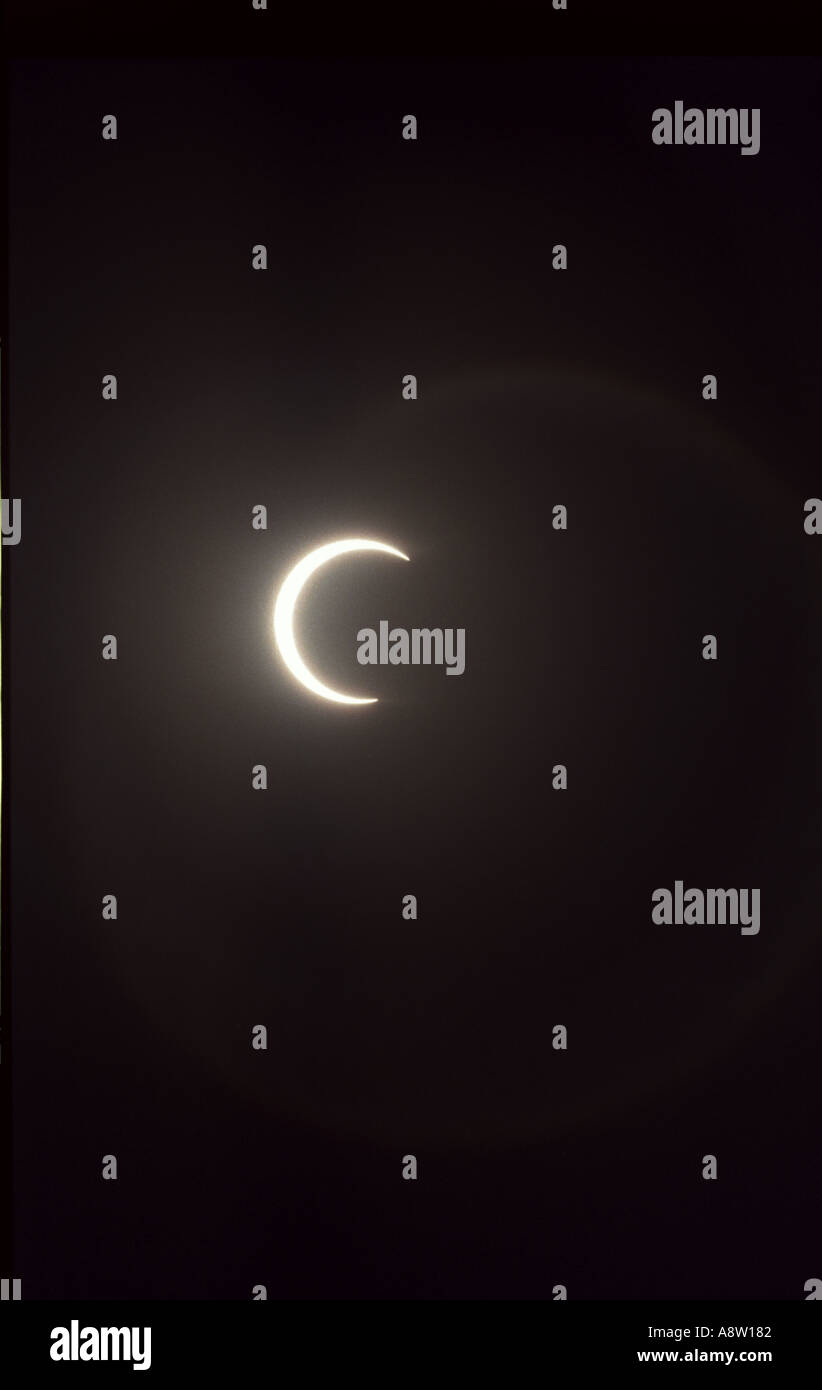 Partial solar eclipse moon covering sunlight Stock Photo - Alamy