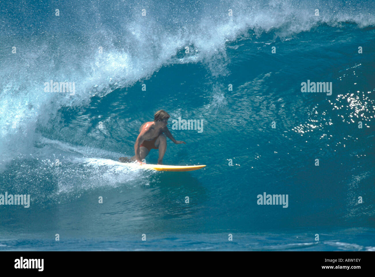 Man surfing barrel wave. Stock Photo