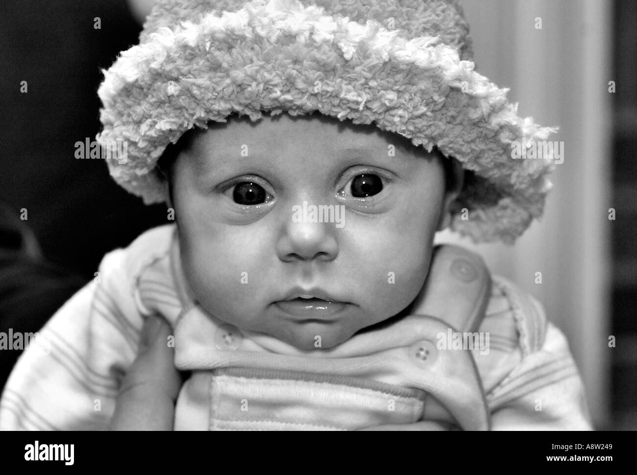Baby girl with hat in black and white Stock Photo