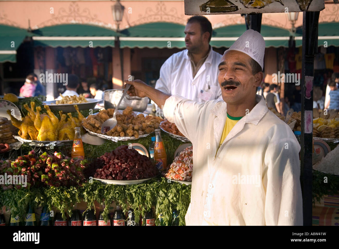 Chef selling spicy food in Jemaa El Fna Square in Marrakech Stock Photo