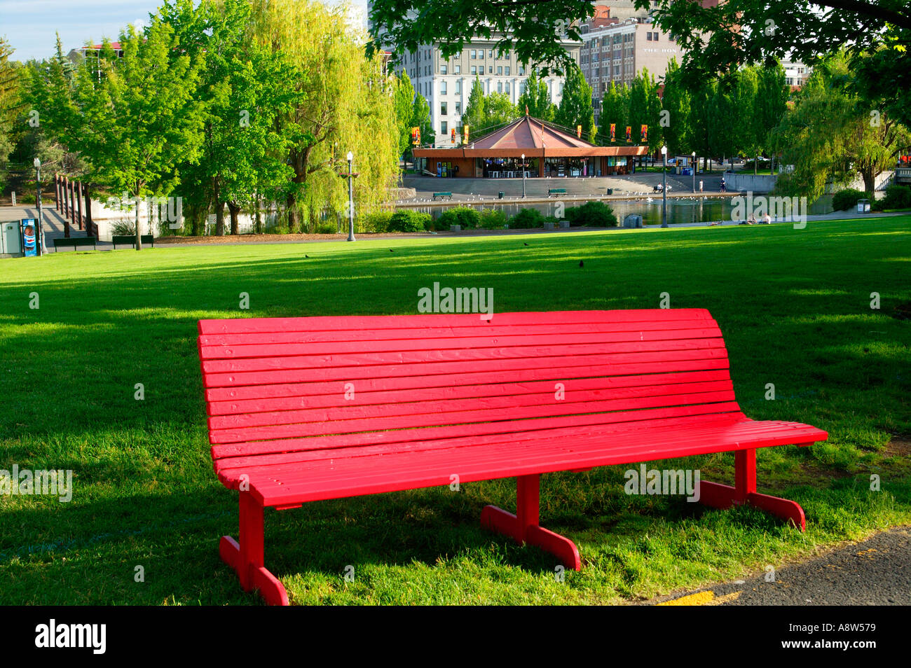 A red bench in Riverfront Park Spokane Washington Stock Photo