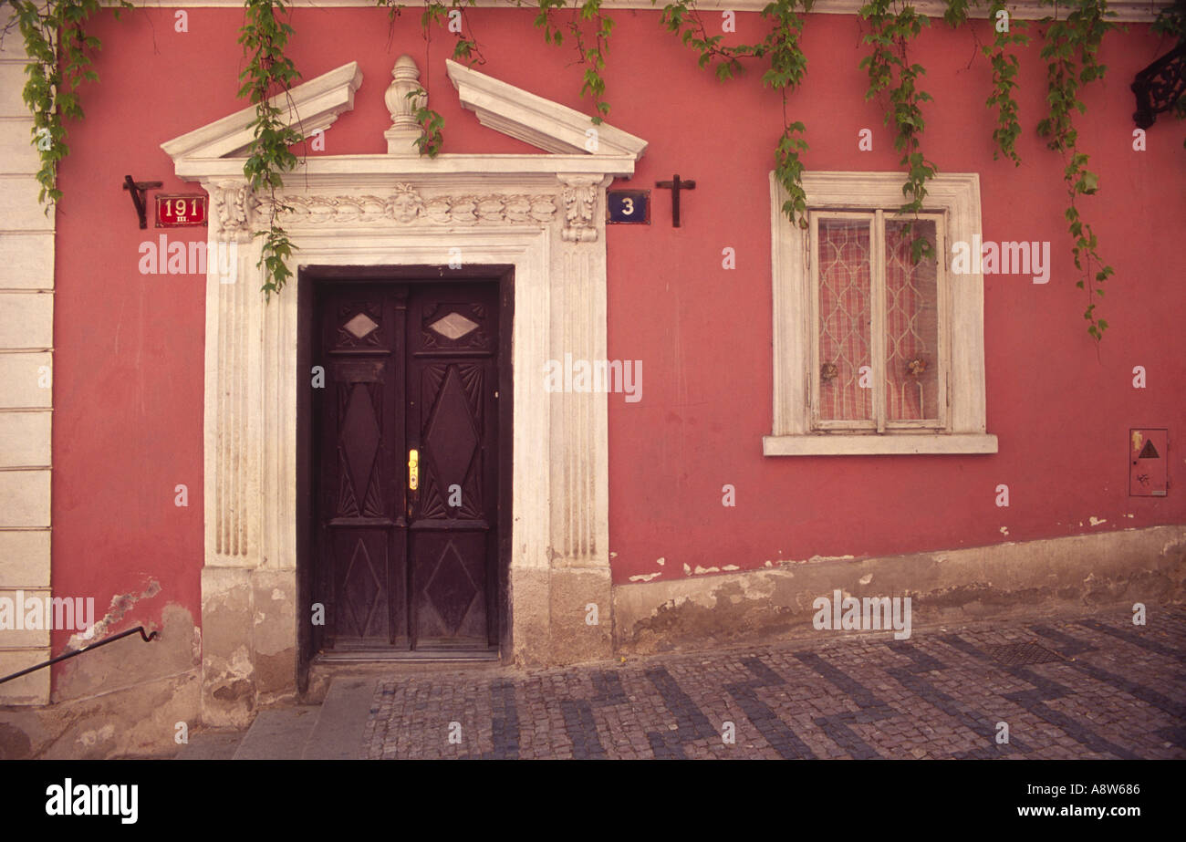 Facade of a small house half way up the steps to the castle in Prague Stock Photo