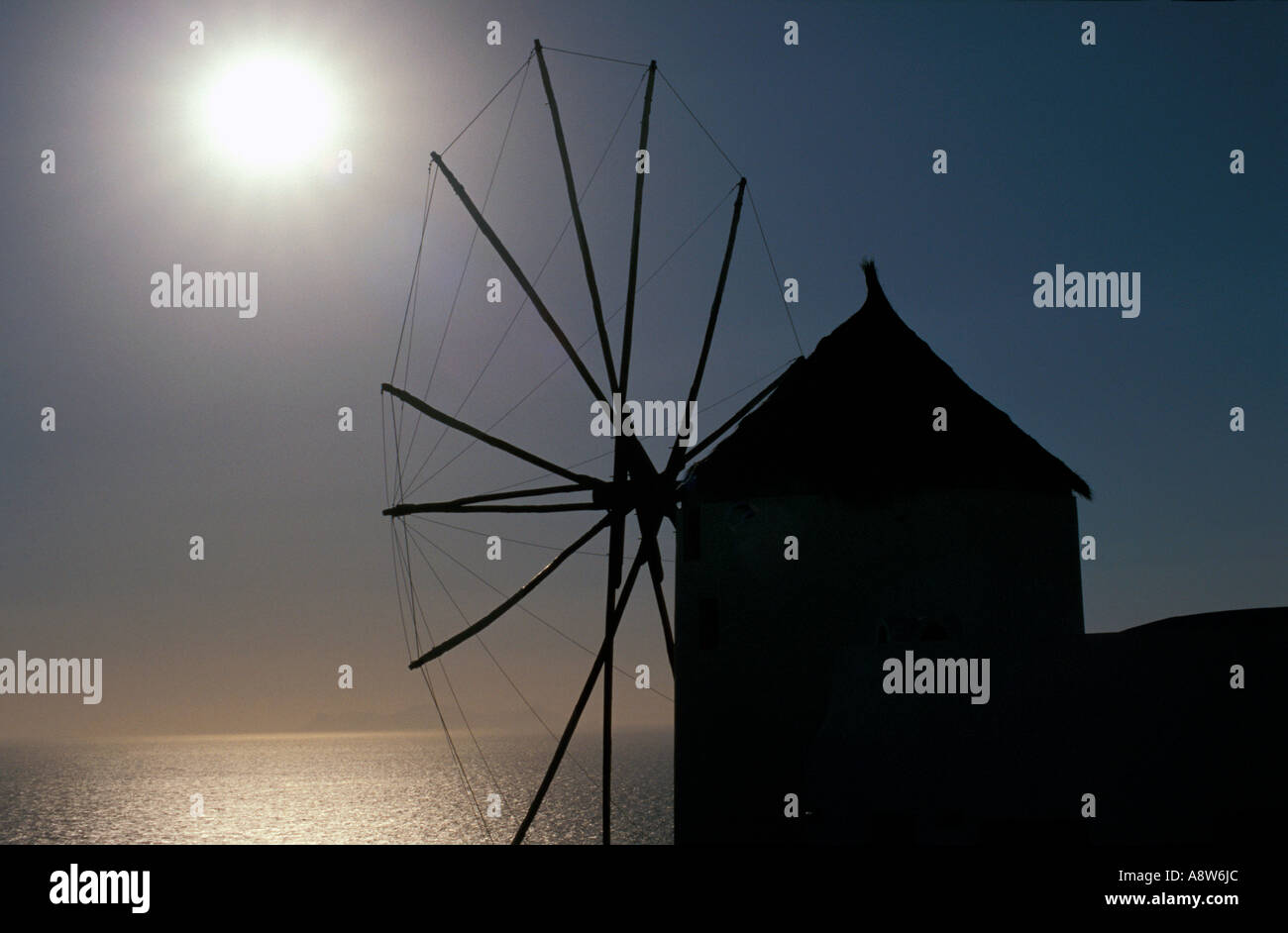 Windmill on the Santorini Island at Sunset, Greece Stock Photo