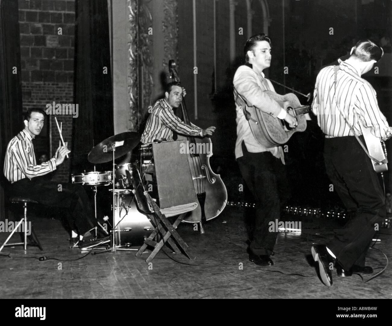 ELVIS PRESLEY  in 1955 with The Blue Moon Boys -Scotty Moore on guitar at righ Bill Black on bass and D J Fontana on drums Stock Photo