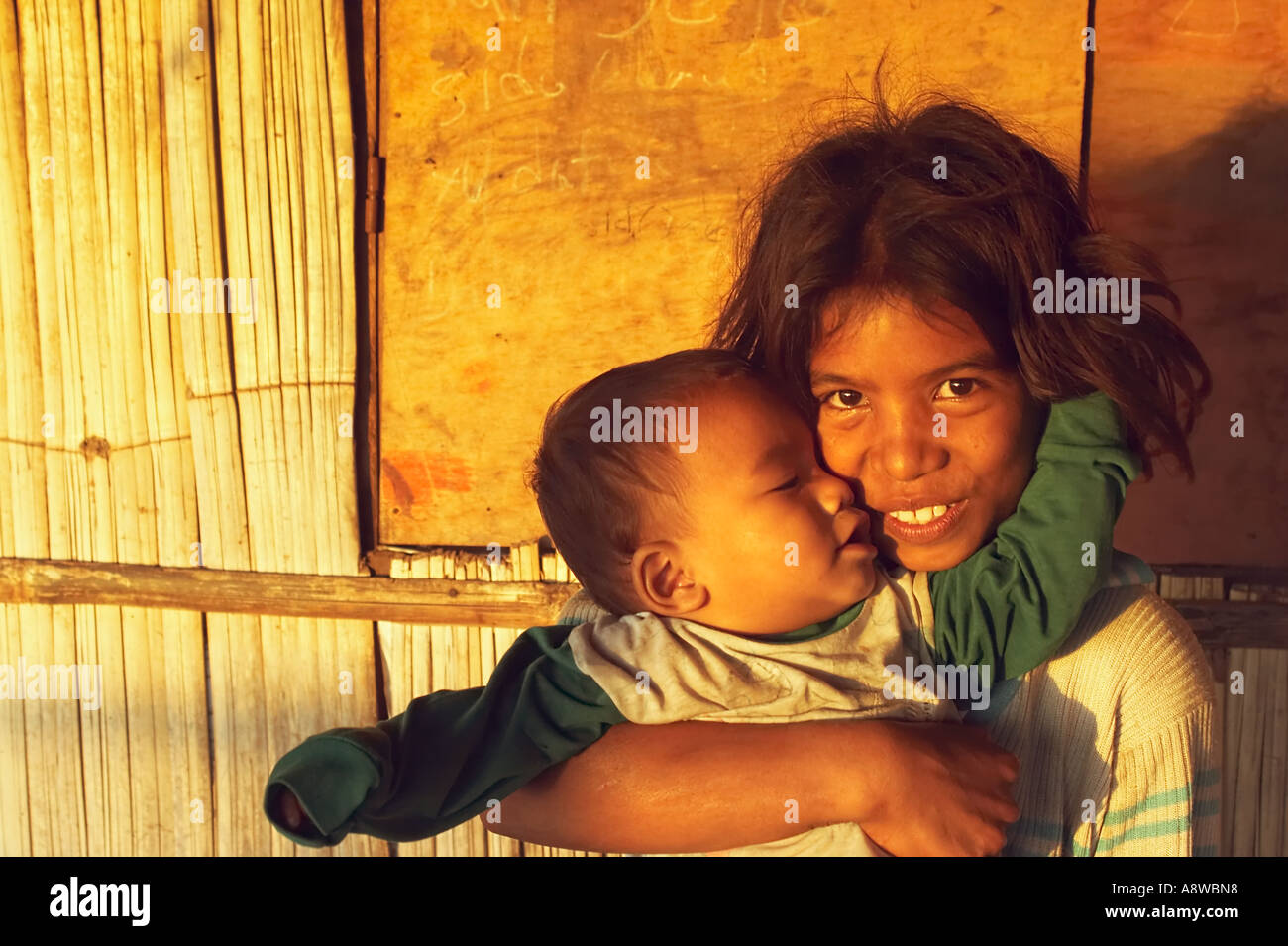 Girl Holding Baby Stock Photo - Alamy