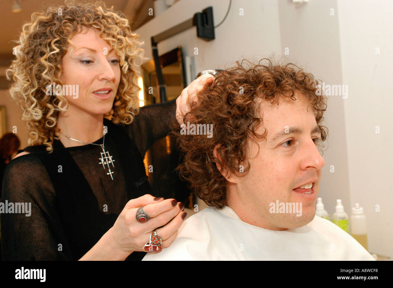 Customers at the Devachan Salon in Soho get their hair styled Stock Photo -  Alamy