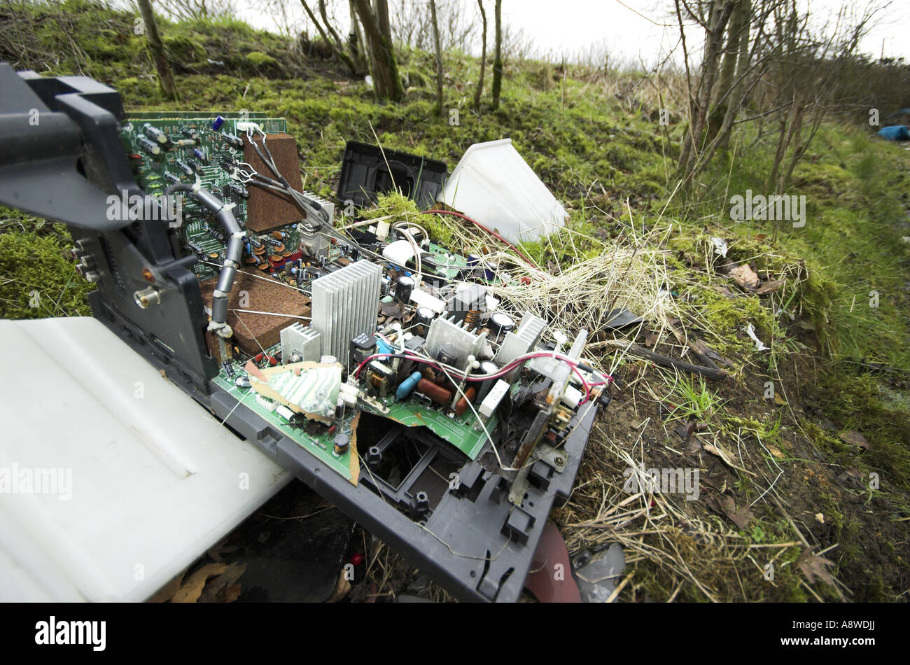 fly tipped tv on the side of the road as watse Stock Photo