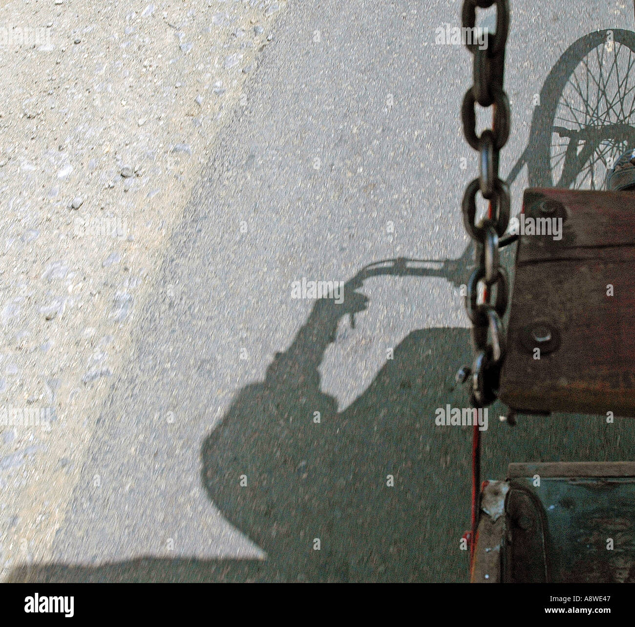 SUB90446 shadow rickshaw puller wheel abstract concept chain bondage ...