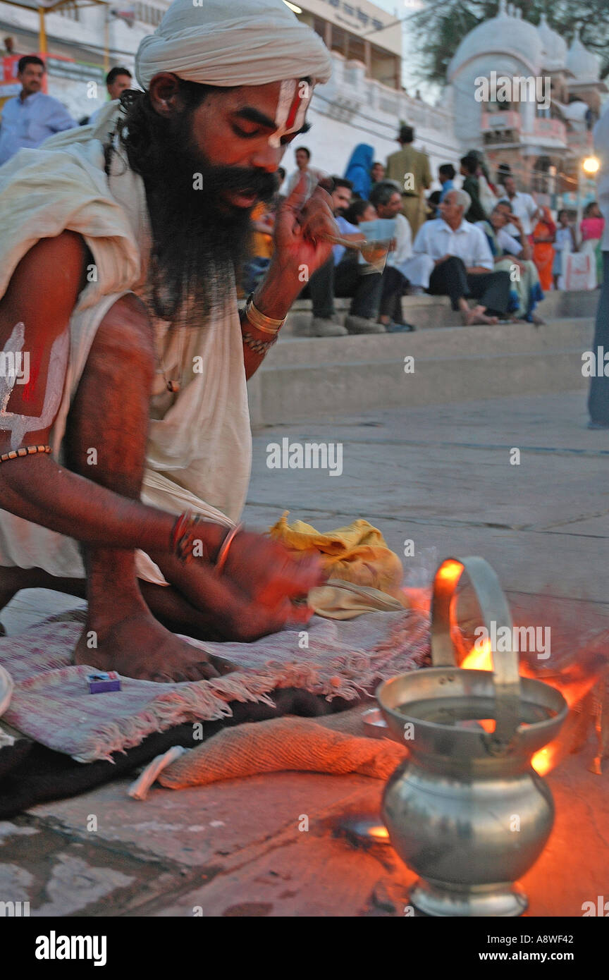 SUB90530 Indian holy priest sadhu praying on roadside Ujjain kumbhmela India Stock Photo