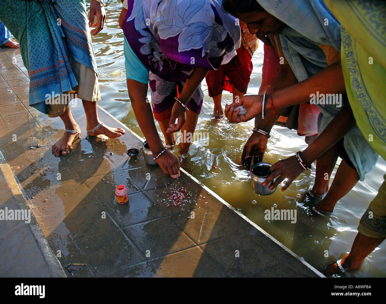 SUB90563 Indian woman praying on banks of the river Shipra Ujjain India Stock Photo
