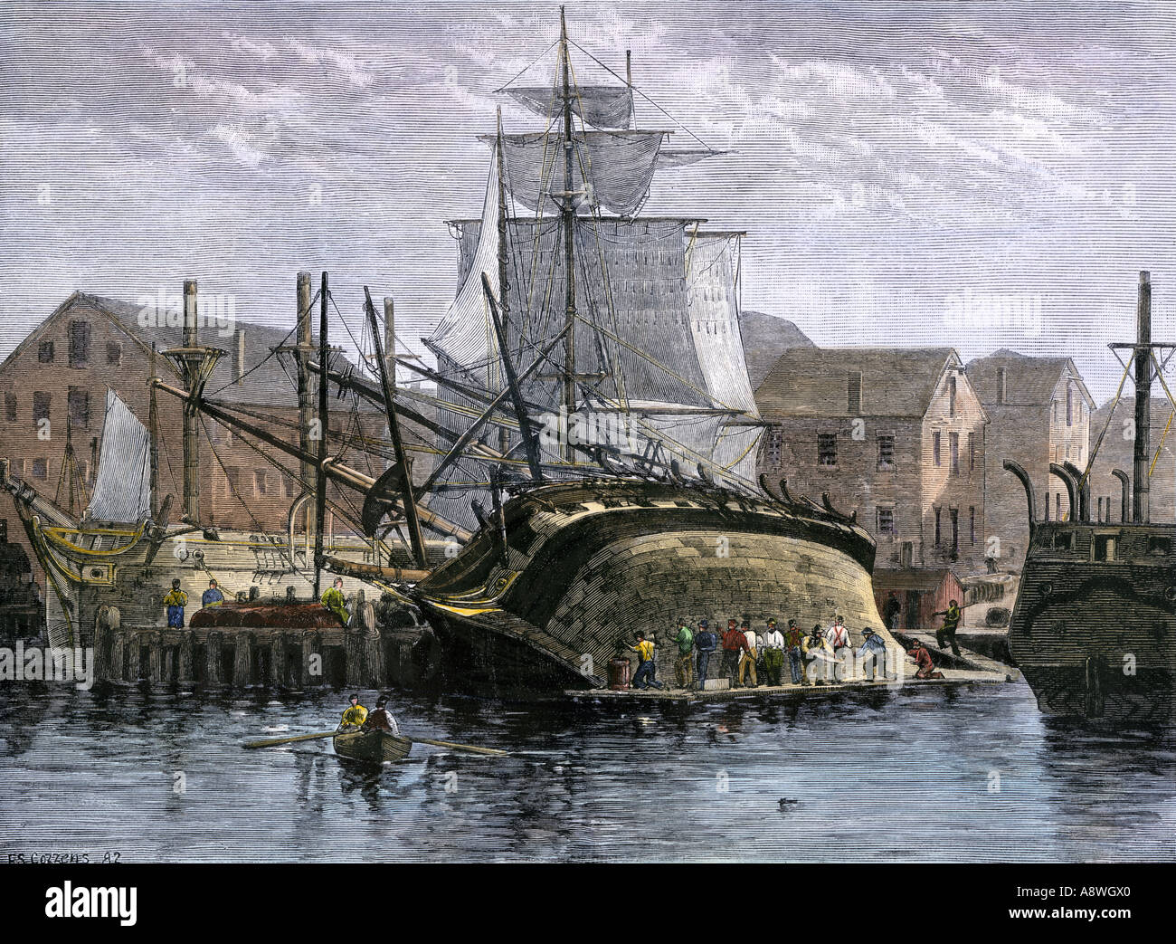Whaling ship hove down for hull repairs in New Bedford Massachusetts 1800s. Hand-colored woodcut Stock Photo