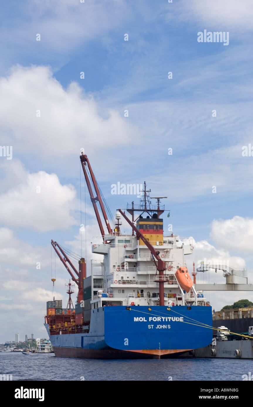 A Container ship docked in the port of Manaus unloading or loading ...