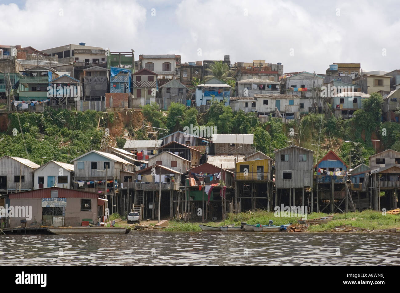 A favela area of Manaus taken from the river on the way out to see "the meeting of the waters" trip. Stock Photo