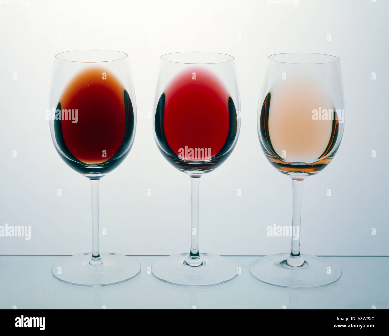 Three glasses wines glasses on side showing different colours of red