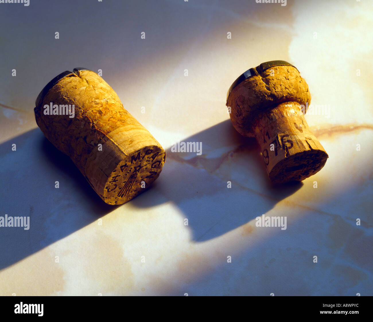 2 champagne corks before and after using in bottles Stock Photo Alamy