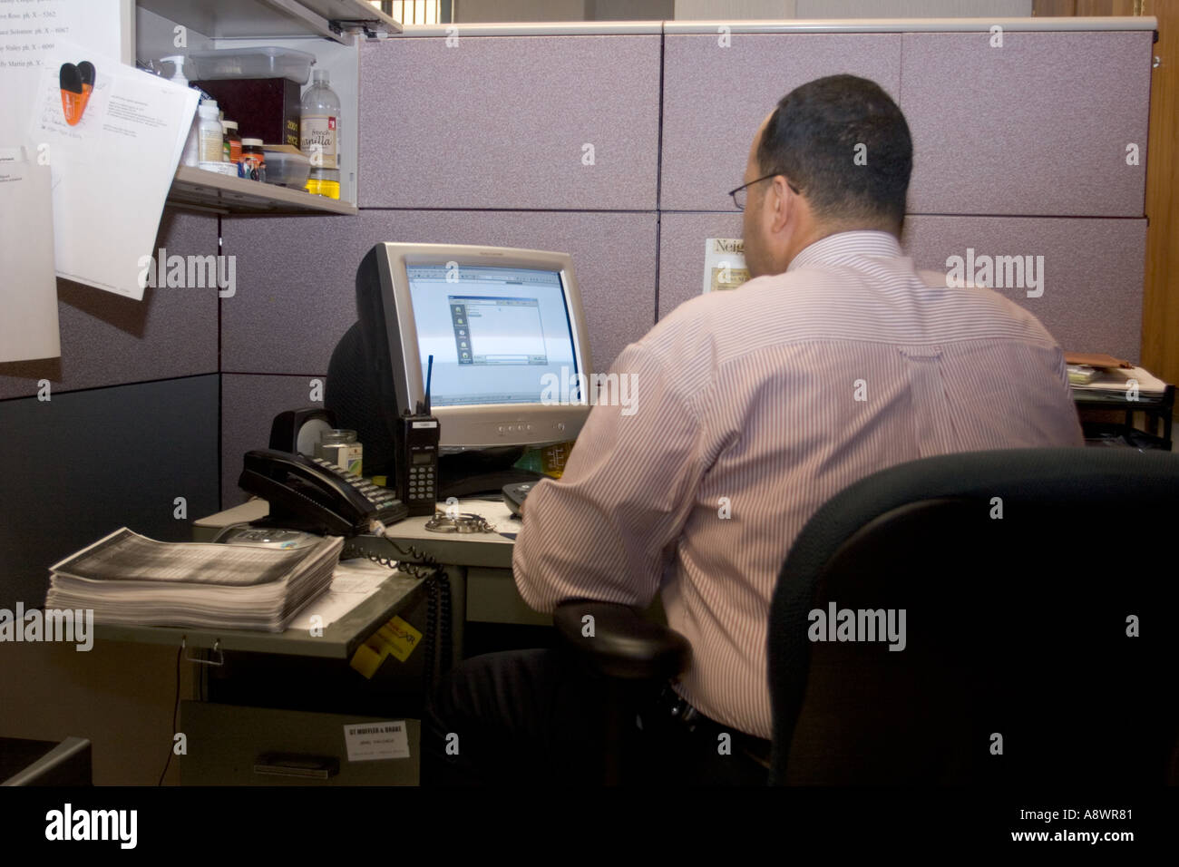 Homicide detective working at desk in police department office. Kansas City, MO, Police