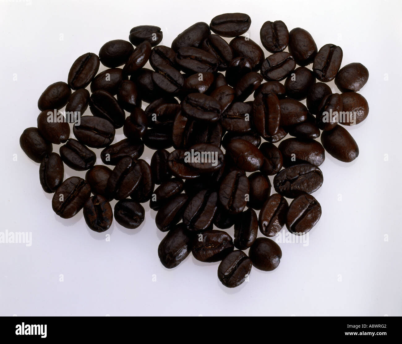 Pile of roast dark brown coffee beans Stock Photo - Alamy