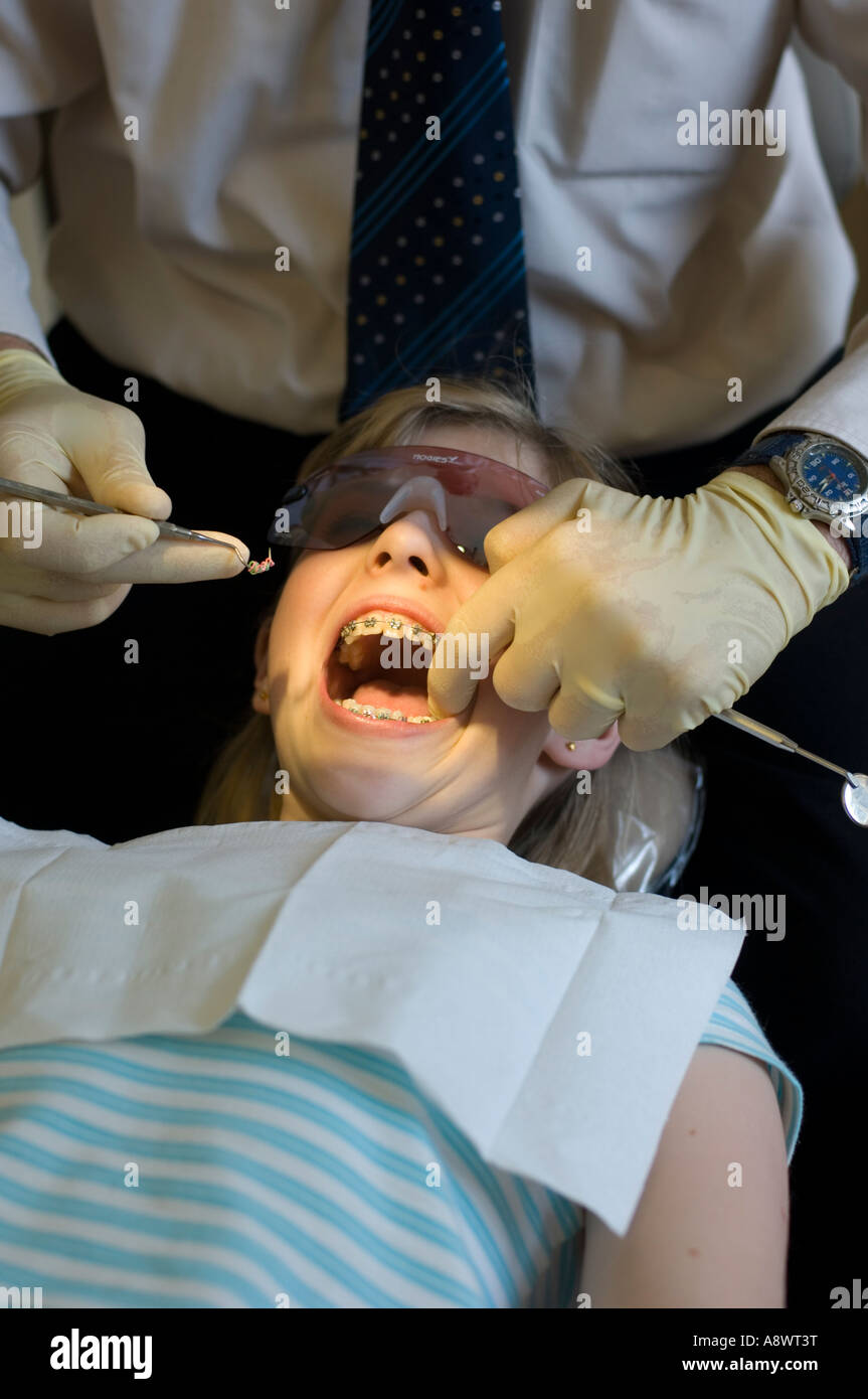 Young girl 12 years old at the dentist orthodontist having brace