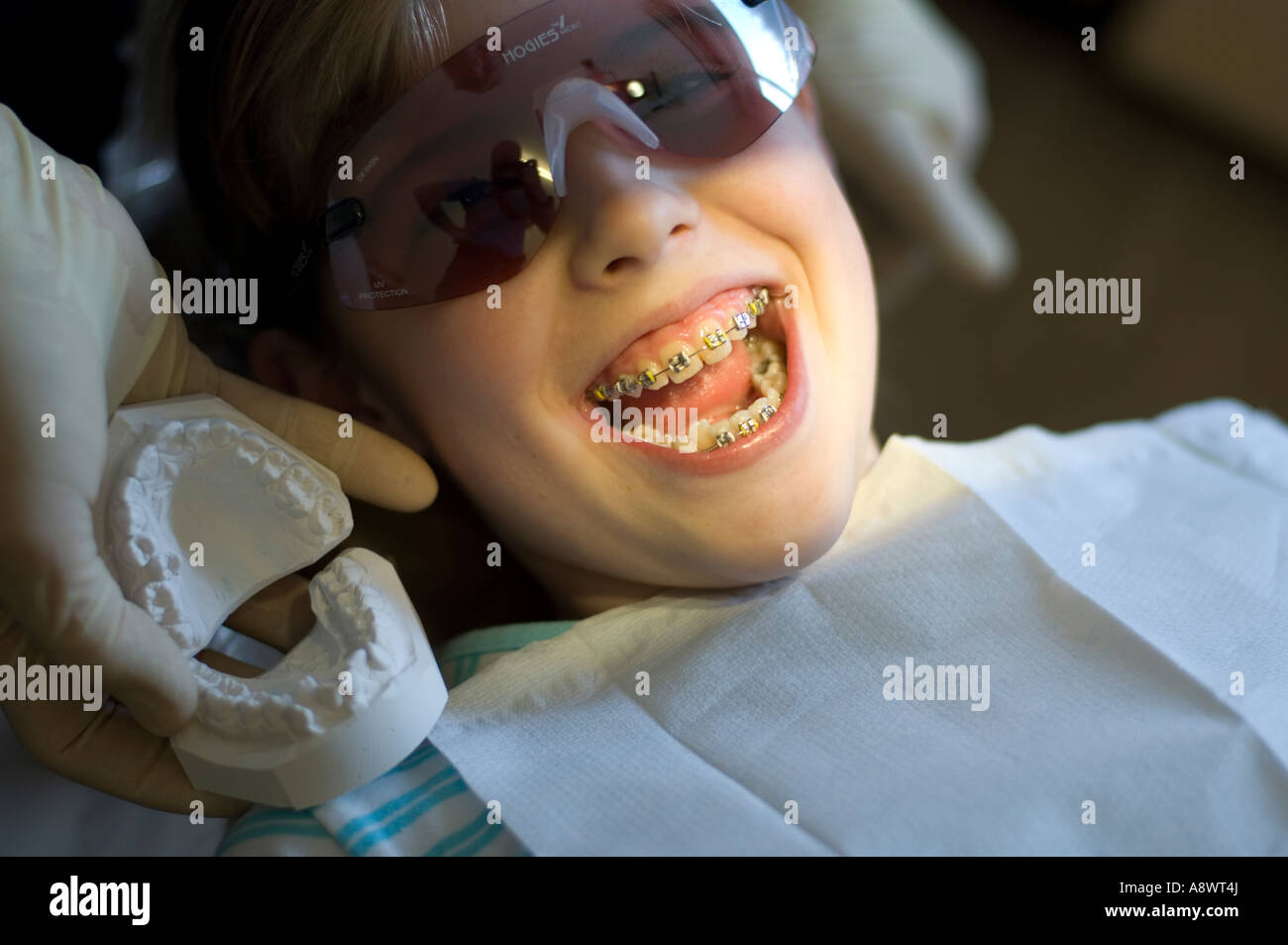 Young girl 12 years old at the dentist orthodontist having brace