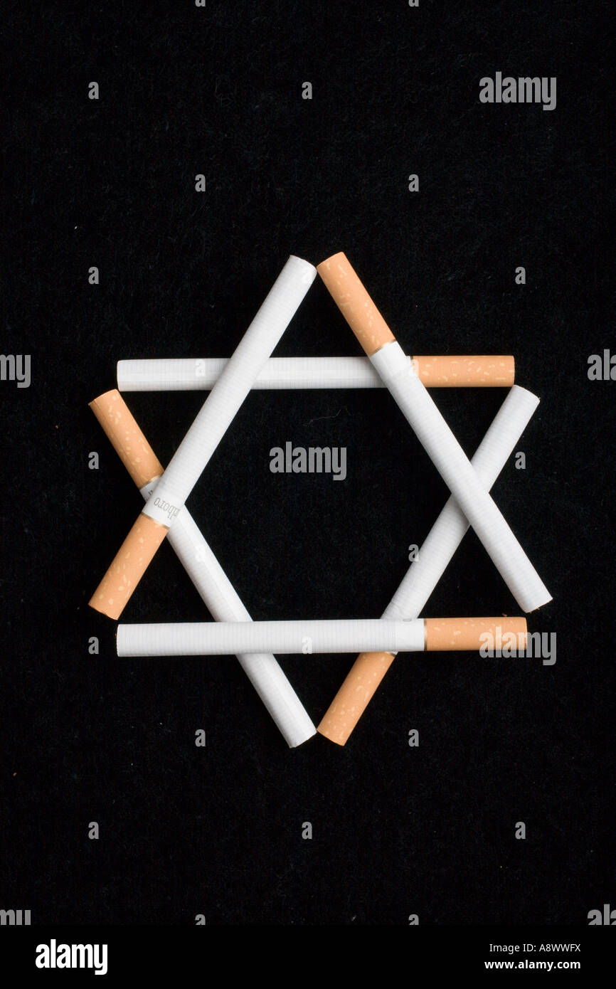 Cigarettes in a shape of jewish star symbolizing a persecution of smokers  Stock Photo
