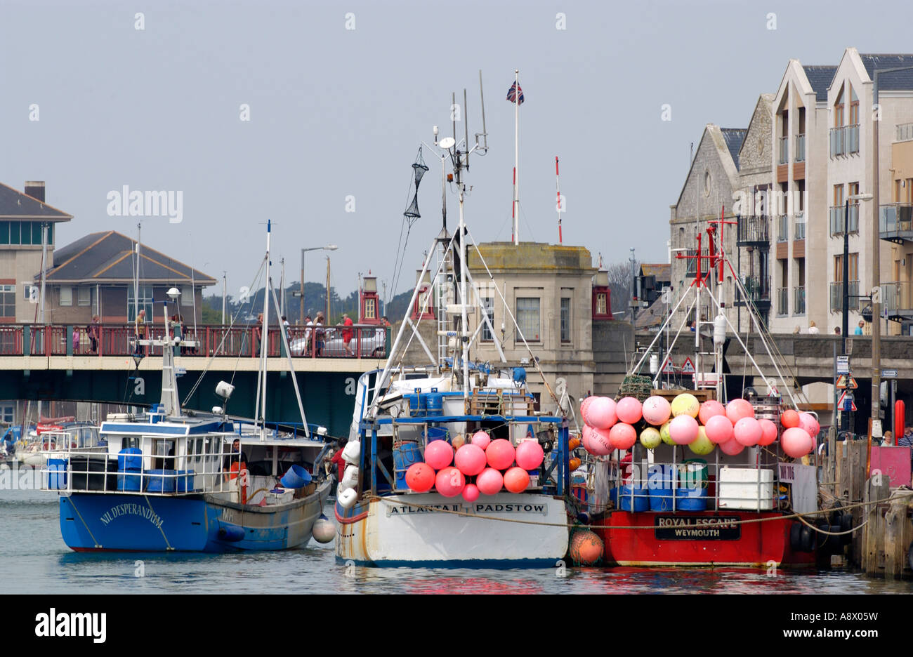 Fishing boats moored on quayside of harbour  at Weymouth Dorset England UK Stock Photo