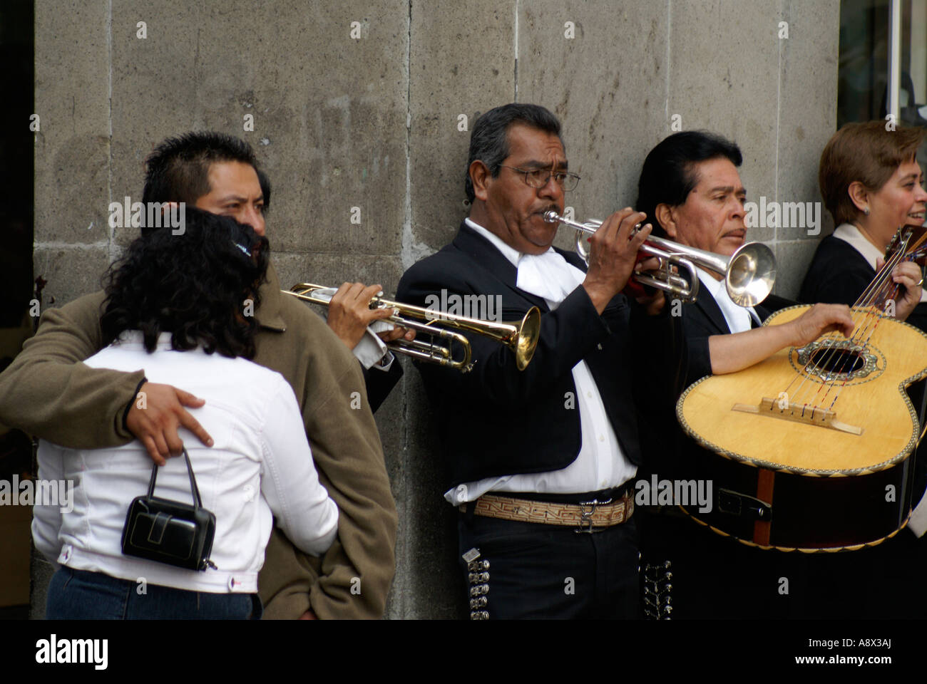 Mariachis playing on the street in downtown Mexico City Stock Photo