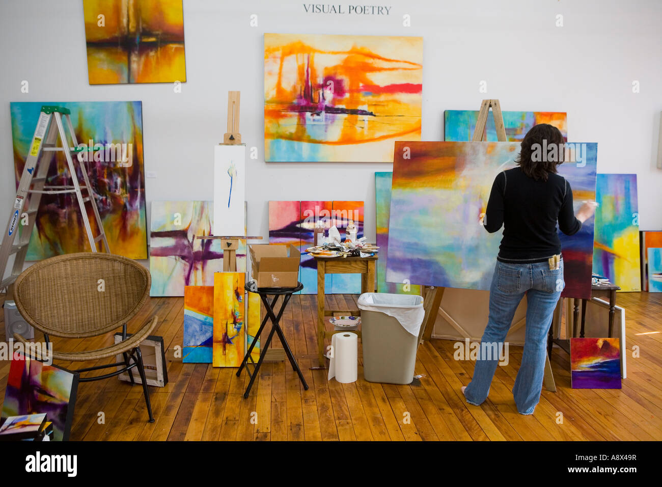 Abstract painter Genie Maples works in her studio River Arts District Asheville North Carolina Stock Photo