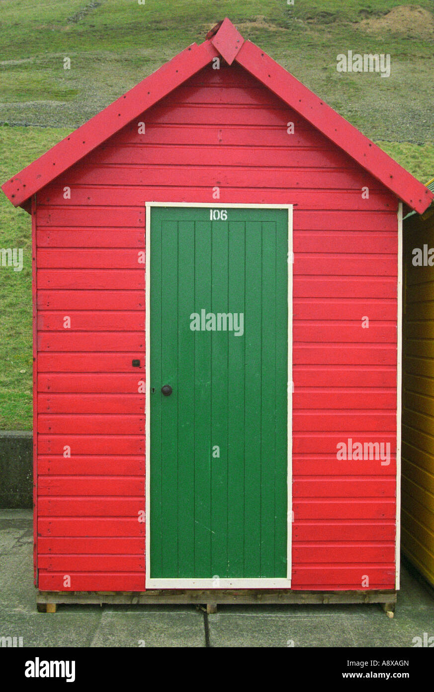 Red Beach Hut with Green Door, Whitby, North Yorkshire, England Stock Photo