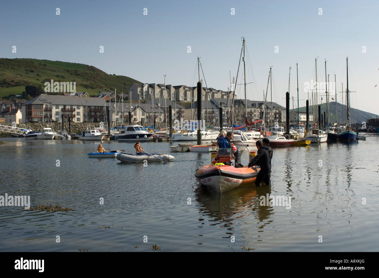 Aberystwyth harbour and marina ; boats and yachts at anchor; flats and
