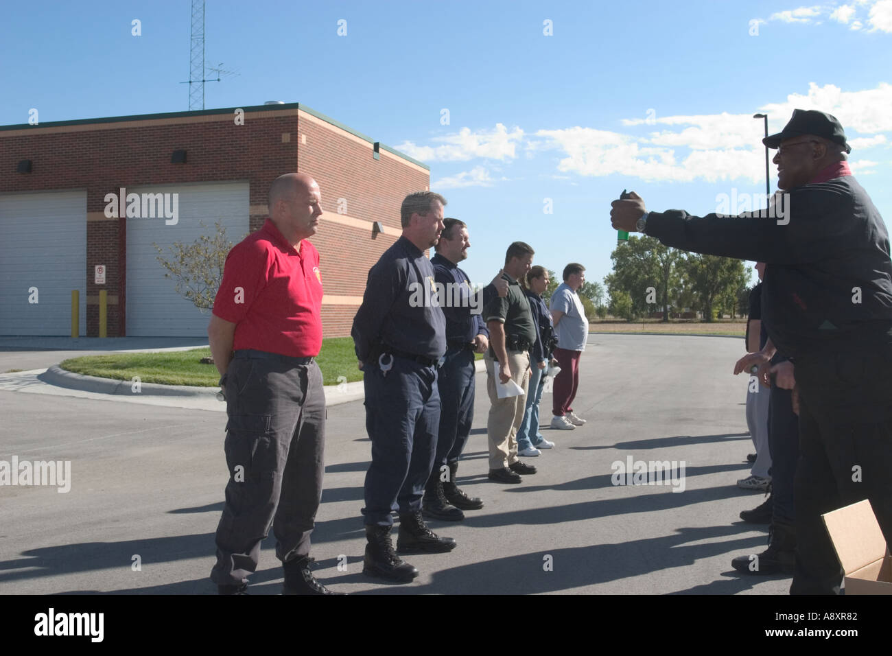Officers spraying each other with training strength pepper spray during training Stock Photo Alamy