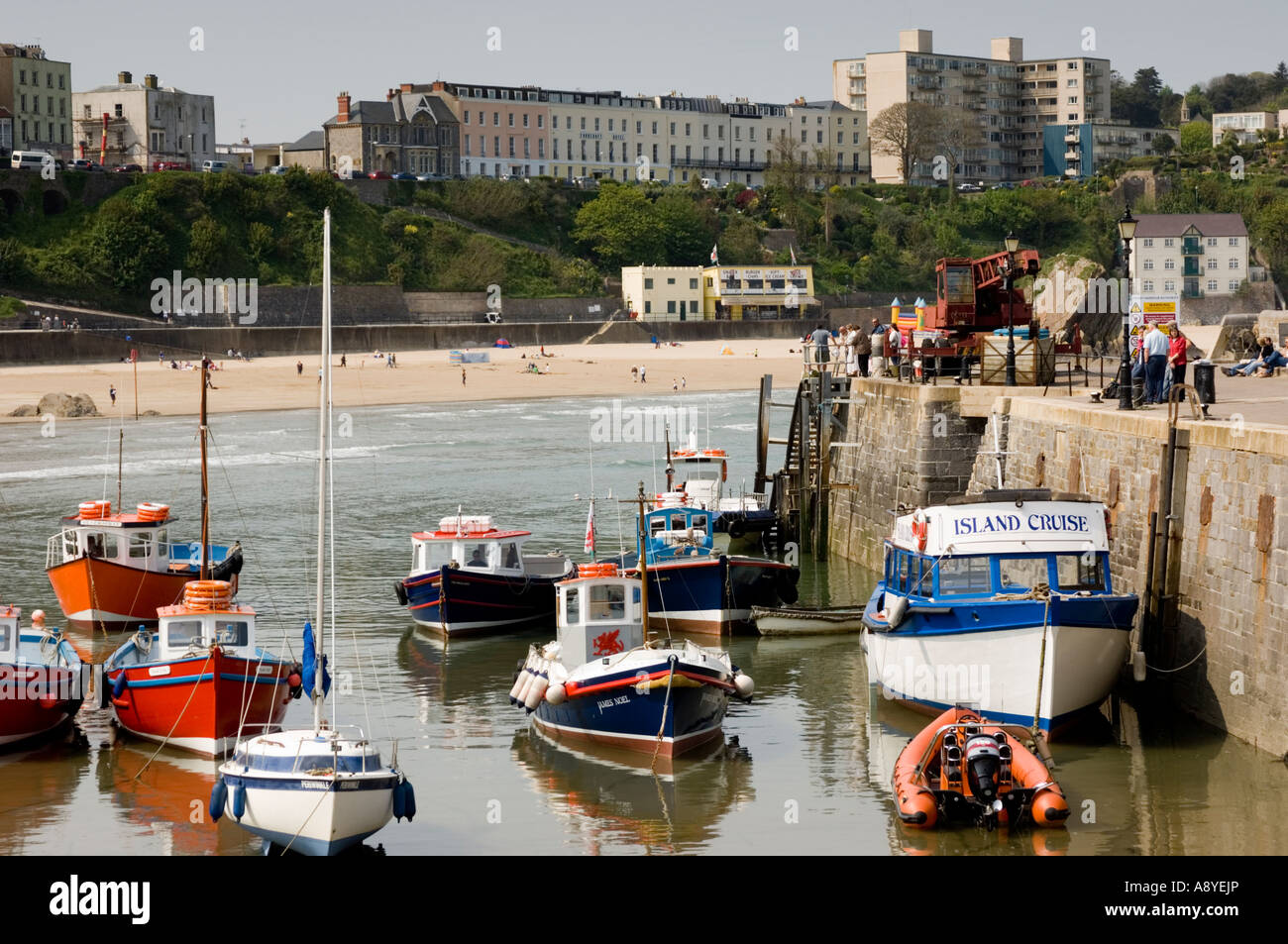 Inshore fishing boats at anchor in the harbour and north beach at low