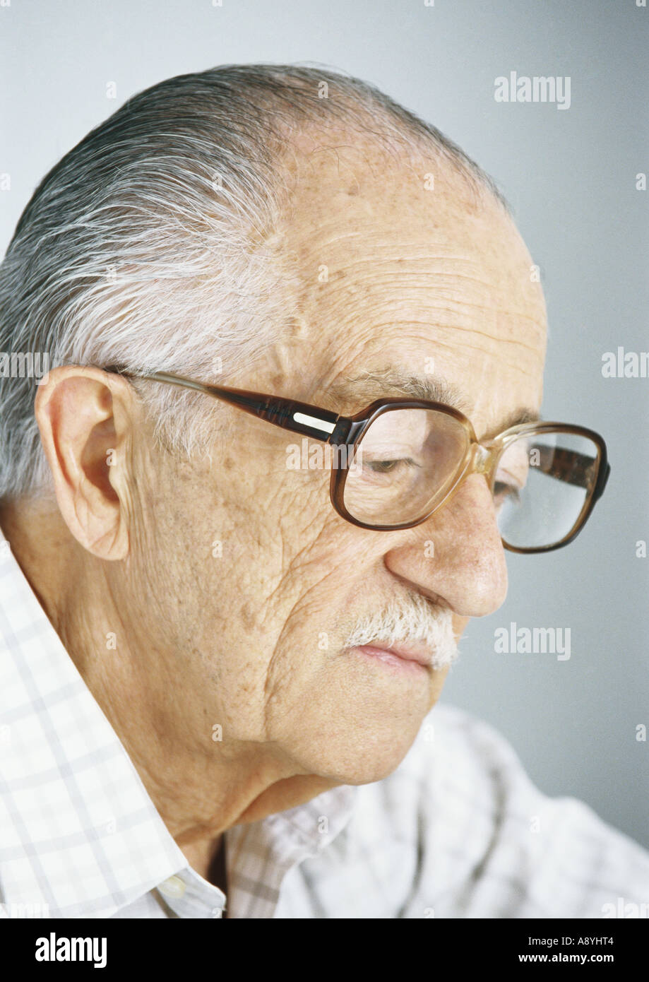 Elderly man wearing glasses Stock Photo