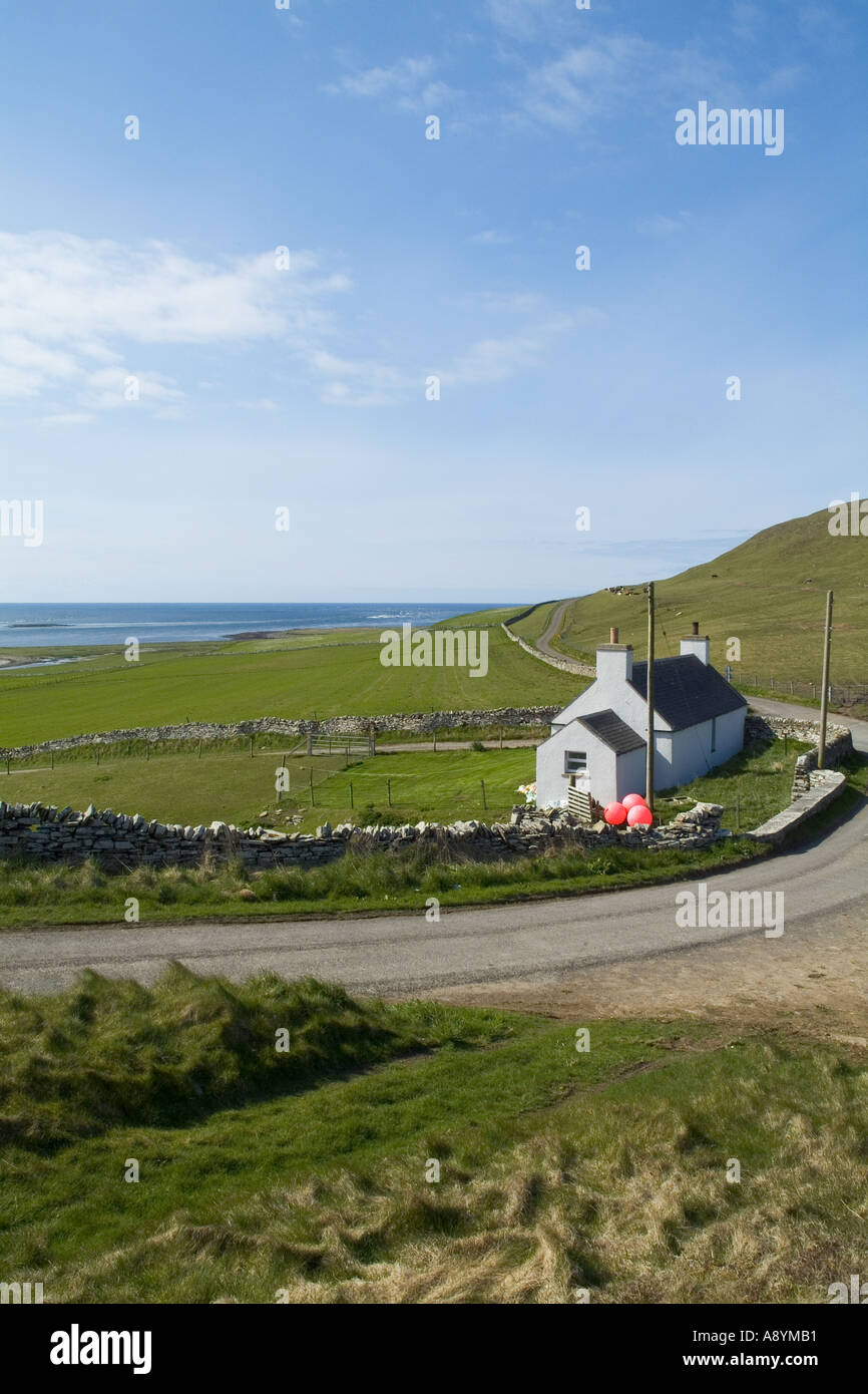 dh  ROUSAY ORKNEY Fishermans white washed croft cottage country road Eynhallow Sound quiet home house Stock Photo