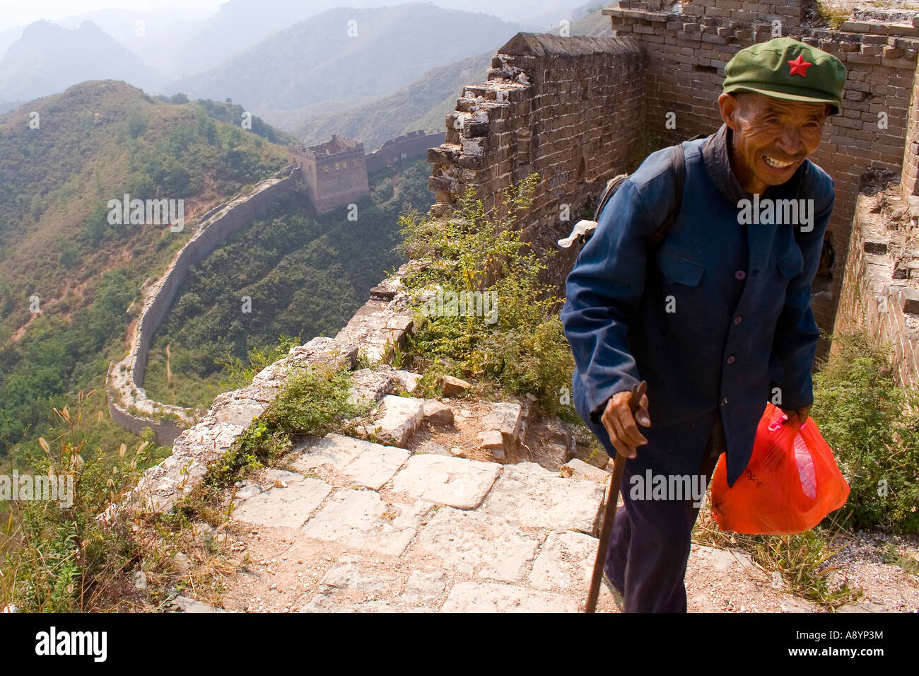 Local Elderly Chinese Man on the Great Wall of China Stock Photo