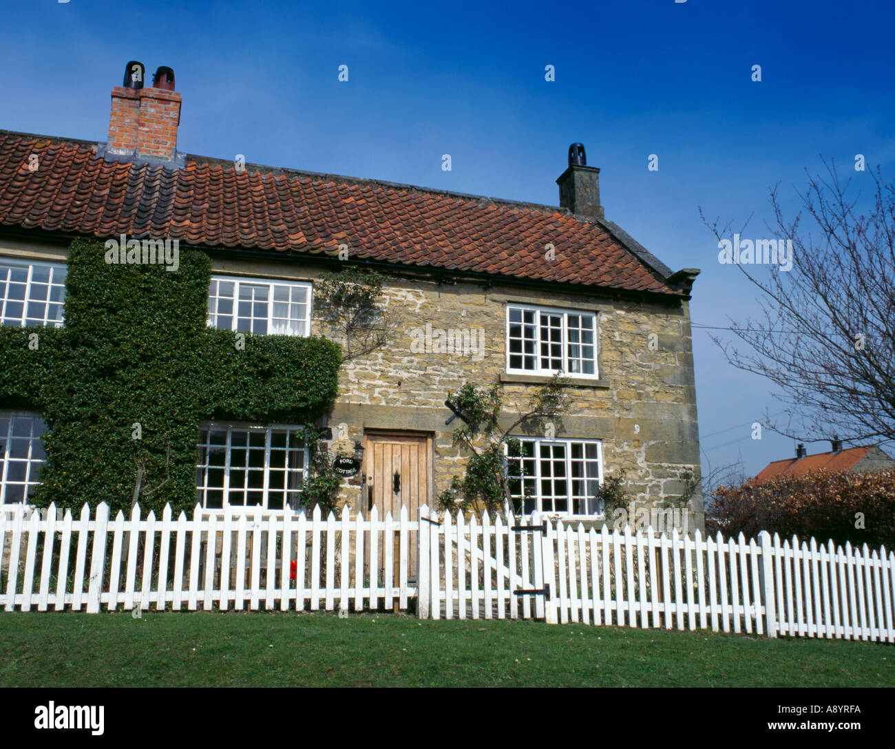 Pretty sandstone house, village of HuttonleHole, North York Moors