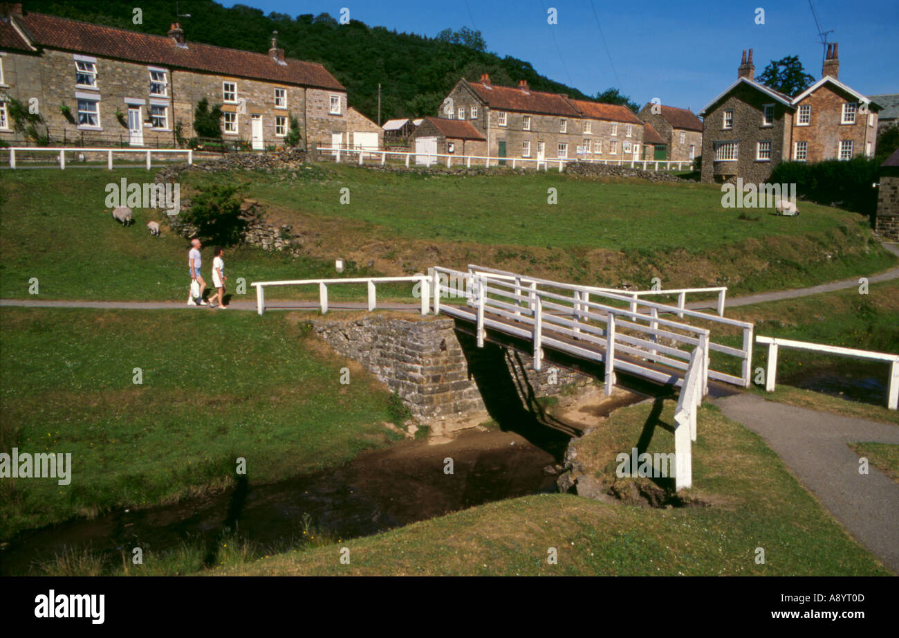 Simple single span footbridge; village of Hutton-le-Hole, North York Moors National Park, North Yorkshire, England, UK Stock Photo